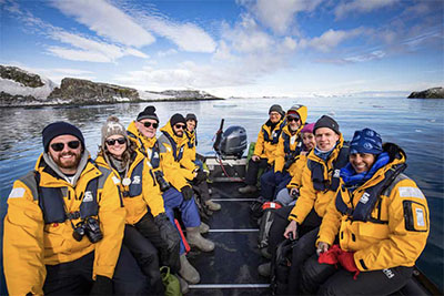 Guests on a Zodiac during an Intrepid Travel tour in Antarctica