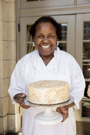 Dolester Miles holding her famous coconut pecan cake