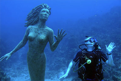 Mermaid statue and diver