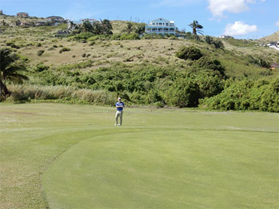 Paul chipping on Hole 15 © FRANCIS X. GALLAGHER